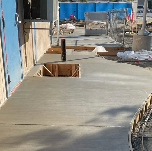 Crew placing and screeding concrete at the Cleveland Early Education Center.